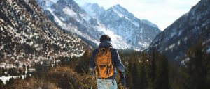 Hiker in the Canadian wilderness with backpack full of essential items